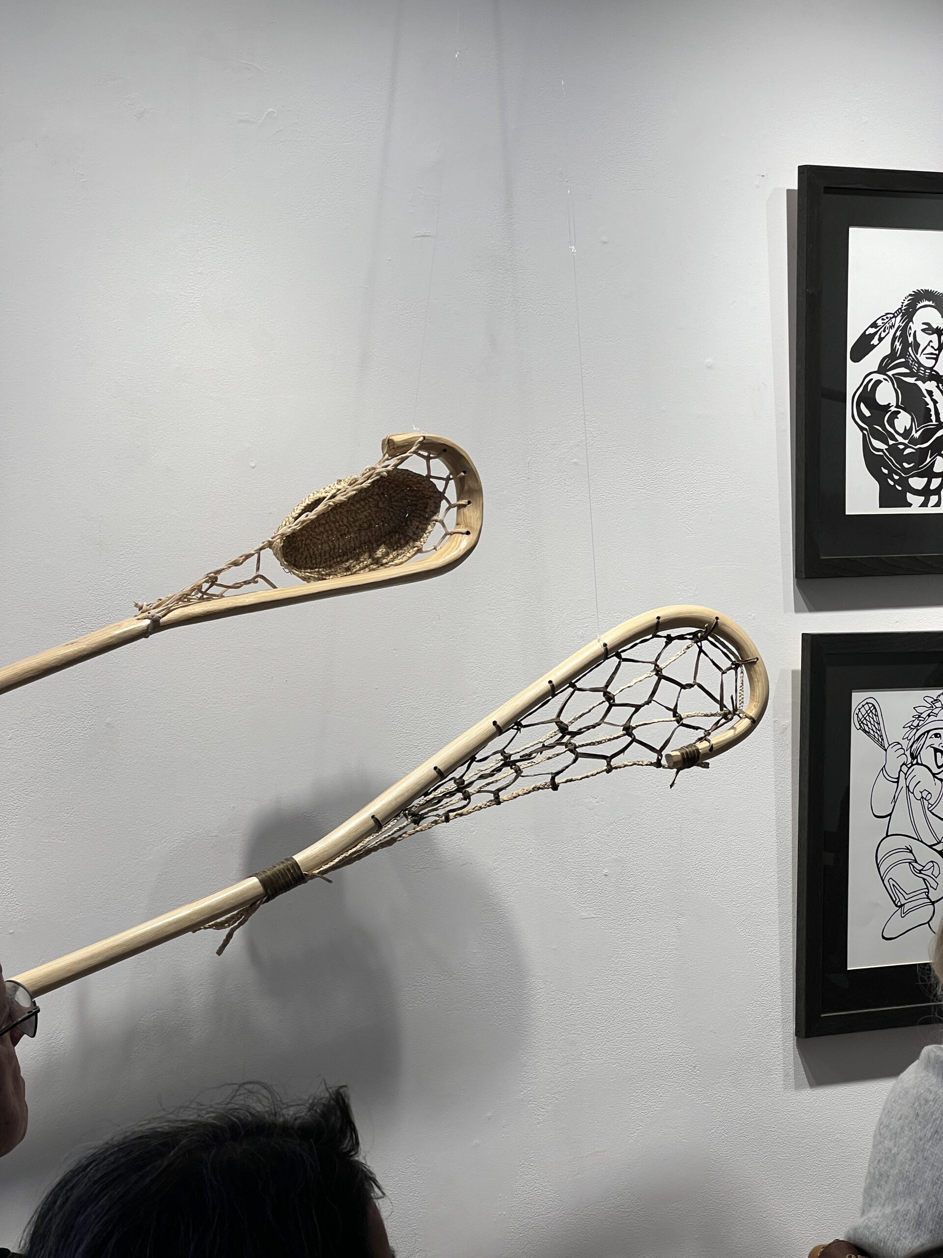 The image contains Lacrosse sticks from story stick collection